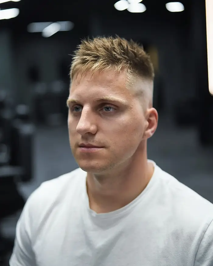 Skin fade with a spiky textured crop on fine blond hair at ONYX barbershop in Hallandale Beach, FL