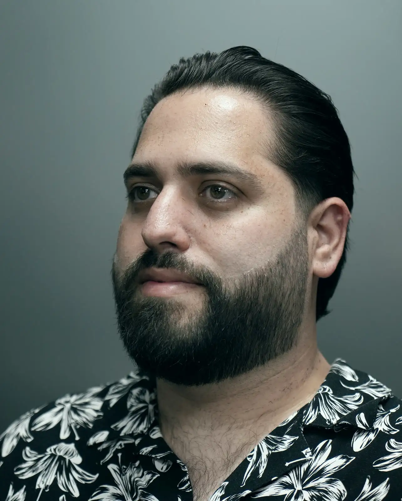 Slick back taper with full beard shape at ONYX barbershop in Hallandale Beach, FL