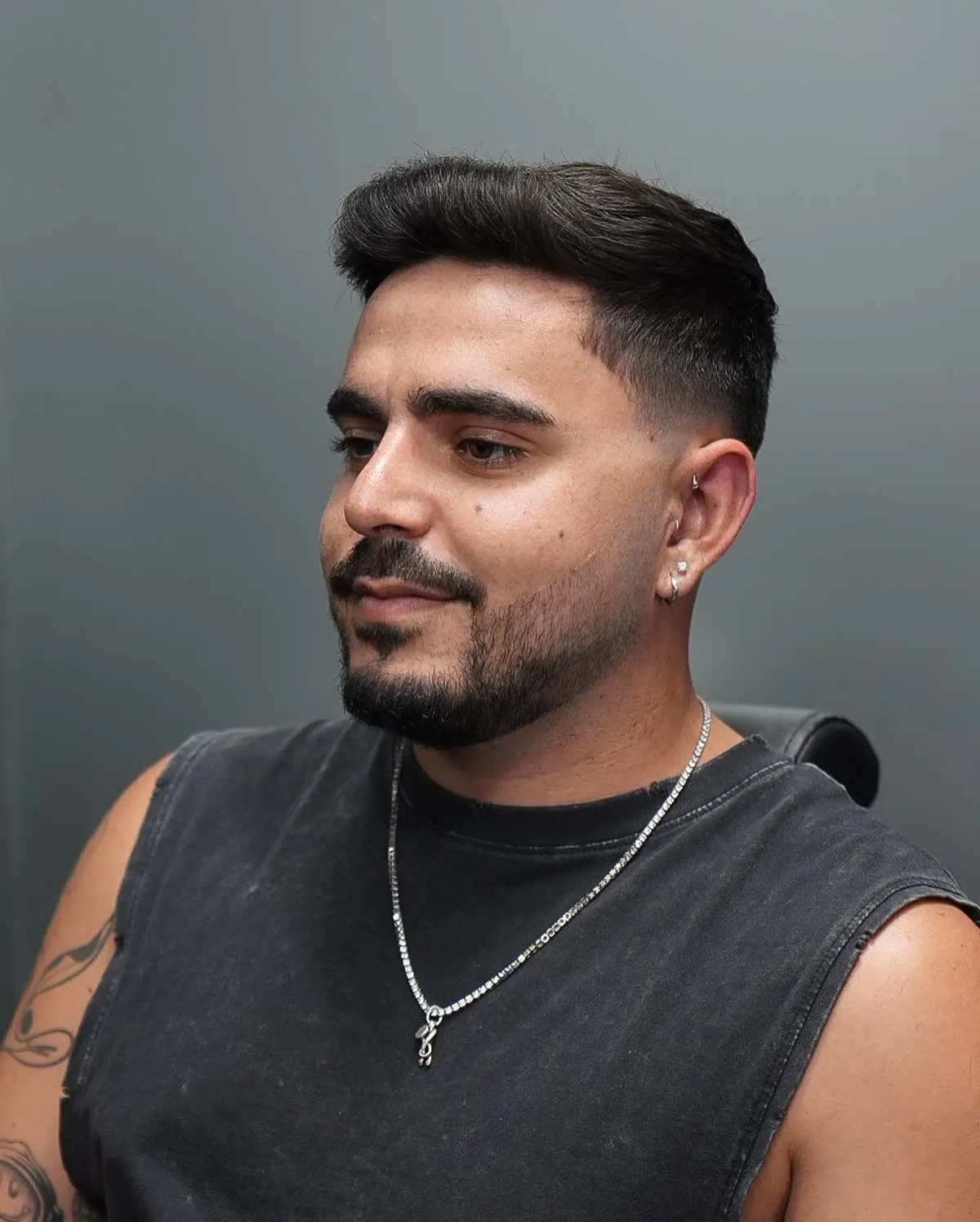 Taper fade haircut with a full beard trim done in one visit at ONYX Barbershop in Hallandale Beach, FL